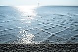 A cross sea is caused by two sets of waves converging at different angles.