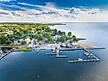 Aerial view of Oxford, Maryland, situated on the Chesapeake Bay, showcasing clouds, water, and shoreline.
